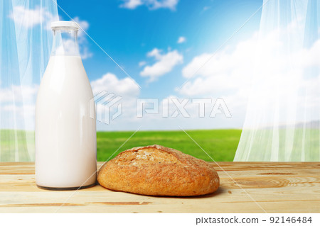 Bread and milk on the table 92146484