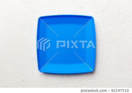 Top view of empty square plate on cement background. Empty space for your design 92147510