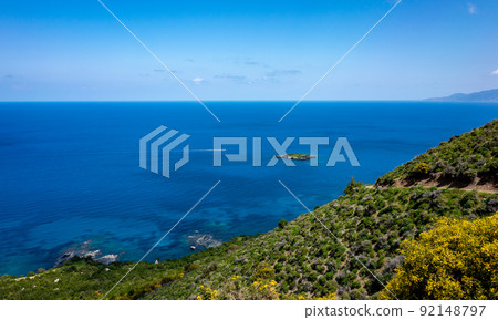 Green mountainous coast of the Mediterranean Sea on the Akamas Peninsula in the northwest of the island of Cyprus. Green mountainous coast of the Mediterranean Sea on the Akamas Peninsula in the northwest of the island of Cyprus. 92148797