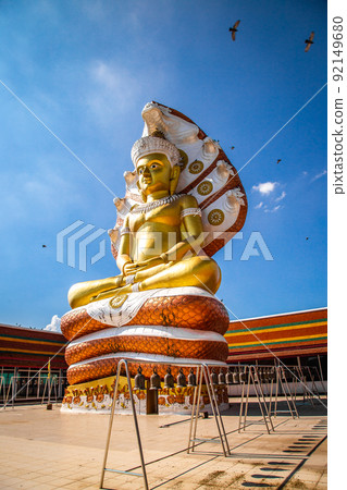 Giant Buddhawith Naga serpent temple in Singburi, Thailand Giant Buddhawith Naga serpent temple in Singburi, Thailand 92149680