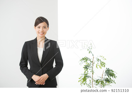 A woman in a suit A woman in a suit 92151310