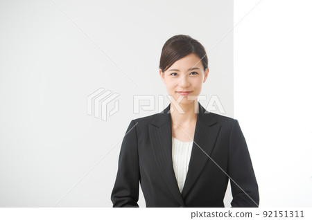 A woman in a suit A woman in a suit 92151311