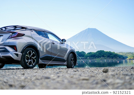 Mt. Fuji and silver SUV from Lake Shoji Mt. Fuji and silver SUV from Lake Shoji 92152321
