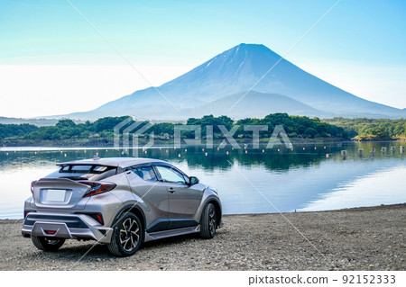 Mt. Fuji and silver SUV from Lake Shoji Mt. Fuji and silver SUV from Lake Shoji 92152333