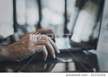 Women handling personal computers Women handling personal computers 92152426