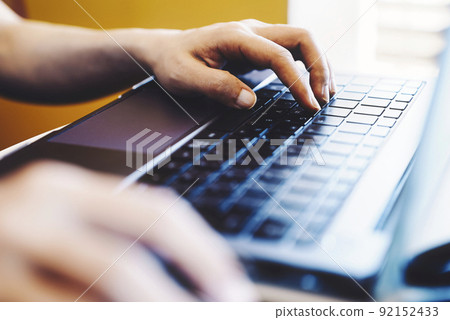 Women handling personal computers 92152433
