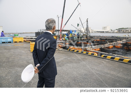 Japanese business port fishing port purchasing sea middle-aged man in a suit Japanese business port fishing port purchasing sea middle-aged man in a suit 92153691