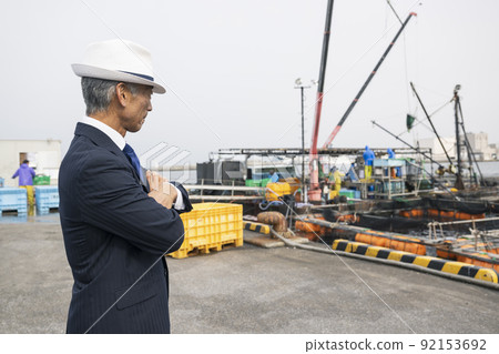 Japanese business port fishing port purchasing sea middle-aged man in a suit Japanese business port fishing port purchasing sea middle-aged man in a suit 92153692