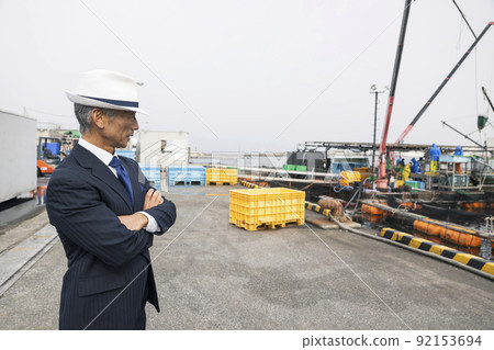 Japanese business port fishing port purchasing sea middle-aged man in a suit Japanese business port fishing port purchasing sea middle-aged man in a suit 92153694
