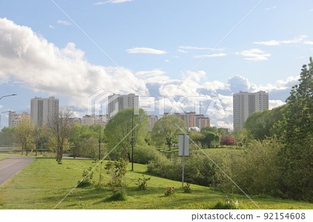 Lush greenery of trees and lawns in the park, urban landscape park. 92154608