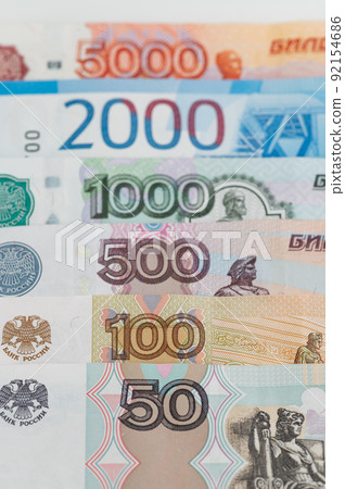 Russian rubles background. Money background and texture. Banknotes of different denominations Russian rubles background. Money background and texture. Banknotes of different denominations 92154686