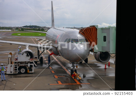 Load luggage on the plane Load luggage on the plane 92155403