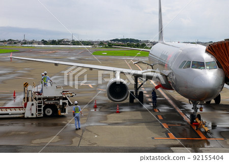 Load luggage on the plane Load luggage on the plane 92155404