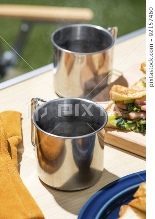 Brew and drink coffee at an outdoor camp Brew and drink coffee at an outdoor camp 92157460