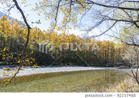Late autumn in Kamikochi: Autumn leaves of larch and Azusa River Late autumn in Kamikochi: Autumn leaves of larch and Azusa River 92157488