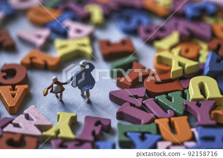 Colorful alphabet and miniature parent and child Colorful alphabet and miniature parent and child 92158716