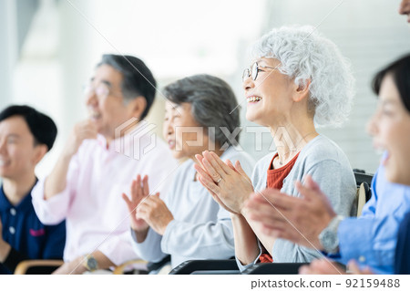 Elderly housing with care users watching the offerings Senior image Caregiver 92159488