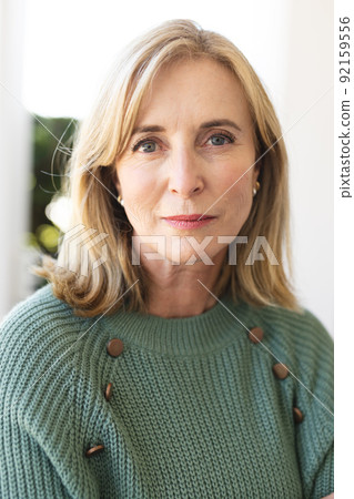 Vertical image of senior caucasian woman looking at camera 92159556