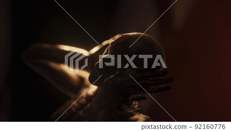 Image of human like monster in dark tunnel being stunned 92160776