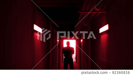 Image of man silhouette standing in dark corridor 92160816