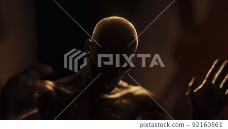 Image of human like monster in dark tunnel being stunned 92160861