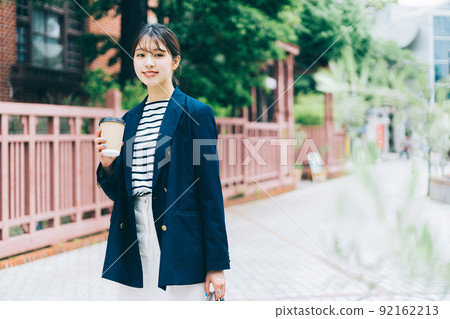 A woman walking in the city of Kobe Kitano A woman walking in the city of Kobe Kitano 92162213