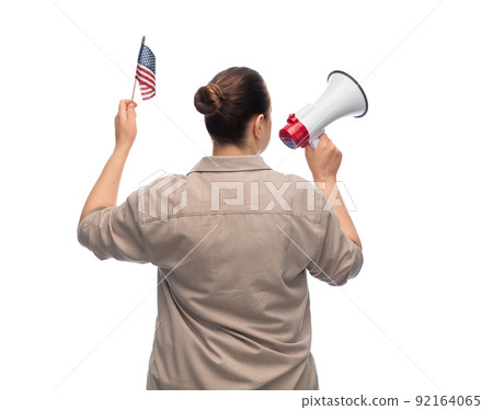 woman with megaphone and flag of united states 92164065