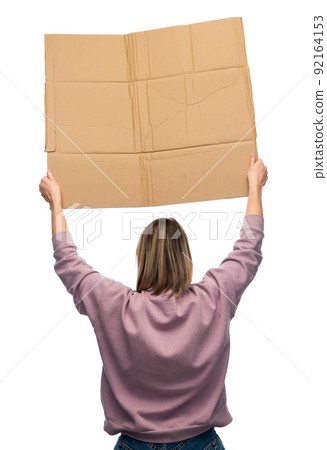 woman with poster protesting on demonstration woman with poster protesting on demonstration 92164153