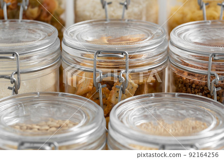 jars with cereals, pasta, beans and cookies 92164256