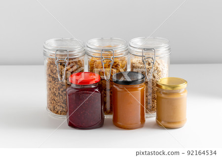 close up of preserves and cereals on table close up of preserves and cereals on table 92164534