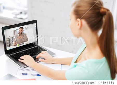 student woman with laptop learning online at home 92165115
