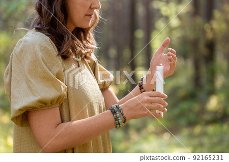 woman with candle performing magic ritual 92165231