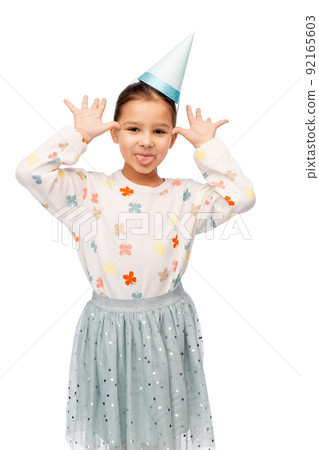 little girl in birthday party hat making faces little girl in birthday party hat making faces 92165603