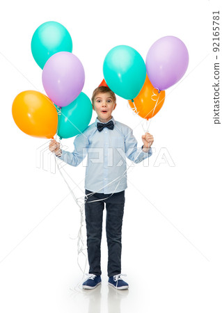 happy boy in birthday party hat with balloons 92165781