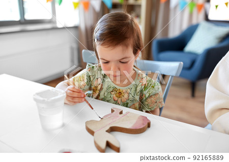 mother with child coloring easter bunny at home mother with child coloring easter bunny at home 92165889