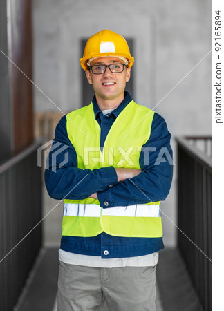male architect in helmet and safety west at office male architect in helmet and safety west at office 92165894