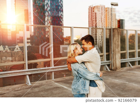 happy young couple on roof top city parking happy young couple on roof top city parking 92166079