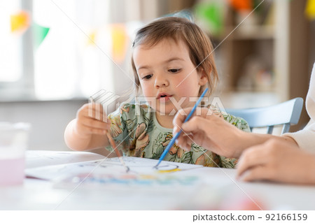 little baby girl drawing at home or kindergarten little baby girl drawing at home or kindergarten 92166159