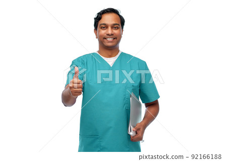 happy indian doctor with folder showing thumbs up happy indian doctor with folder showing thumbs up 92166188