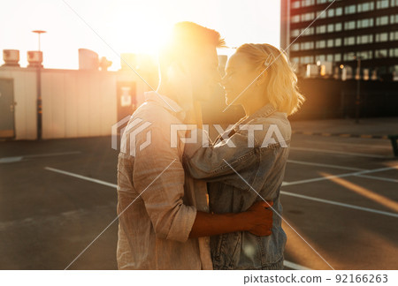 happy young couple on roof top city parking happy young couple on roof top city parking 92166263