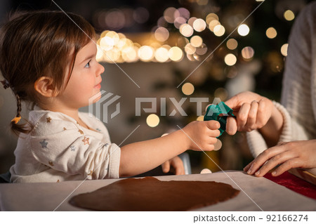 mother and daughter making gingerbread at home mother and daughter making gingerbread at home 92166274