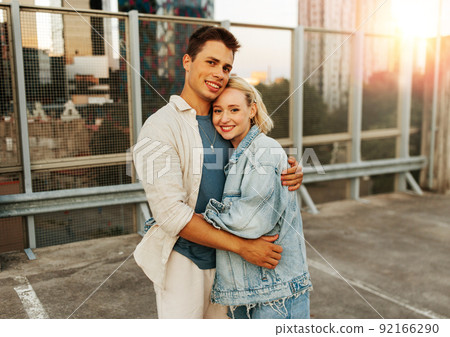 happy couple hugging on roof top city parking happy couple hugging on roof top city parking 92166290