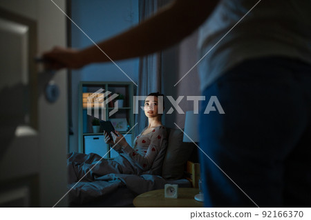 teenage girl with tablet pc in bed at night teenage girl with tablet pc in bed at night 92166370