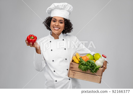 happy smiling female chef with food in wooden box happy smiling female chef with food in wooden box 92166377