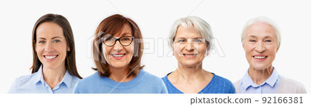 group of happy smiling women in different age 92166381