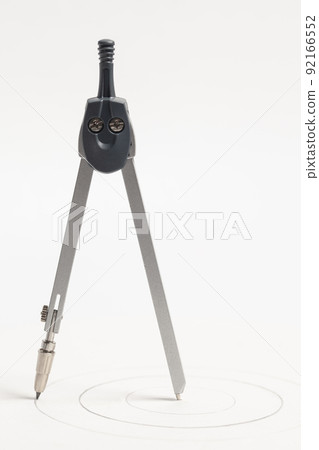 Metallic drawing compass isolated on white background Metallic drawing compass isolated on white background 92166552