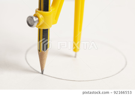 Yellow compass with pencil isolated on white background Yellow compass with pencil isolated on white background 92166553