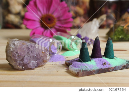 Incense Cones on Stone Slab With Crystals and Flowers Incense Cones on Stone Slab With Crystals and Flowers 92167264