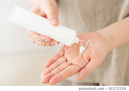 Middle woman applying cream 92172158