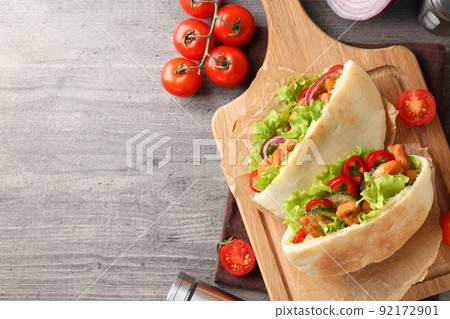 Concept of tasty food with pitas with chicken, space for text Concept of tasty food with pitas with chicken, space for text 92172901
